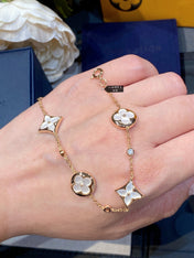 STAR AND SUN 4 MOTIF WHITE MOP PINK GOLD BRACELET