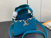 CAPUCINES MINI 21 BLUE TAURILLON GOLD  HARDWARE