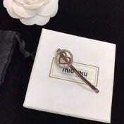 MIUMIU 26S CRYSTAL HEART LOGO HAIR CLIP IN SILVER TONE METAL 617641