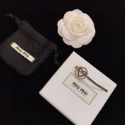 MIUMIU 26S CRYSTAL HEART LOGO HAIR CLIP IN SILVER TONE METAL 617641