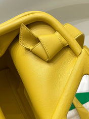 TRIANGLE HANDLE BAG 31 IN DANDELION YELLOW LAMBSKIN