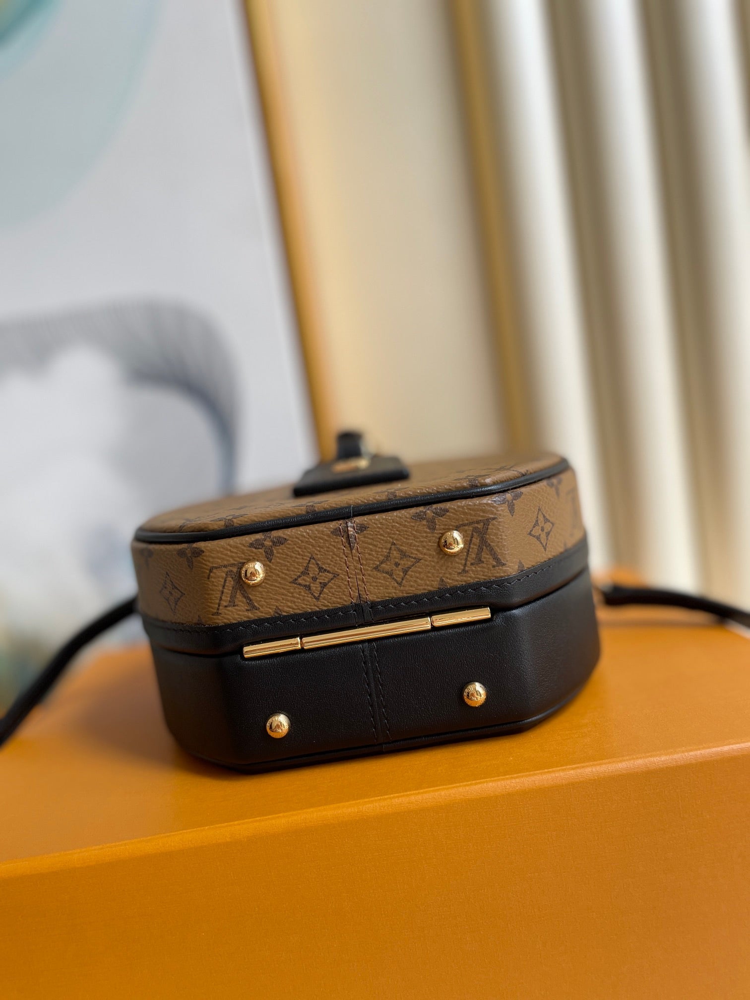 LV 25S PETITE BOITE CHAPEAU 17 IN BLACK MONOGRAM REVERSE CALFSKIN