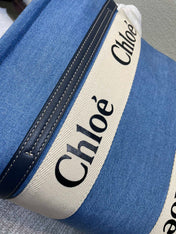 MEDIUM STRAP WOODY TOTE BAG 37 IN BLUE DENIM CANVAS DARK BLUE CALFSKIN