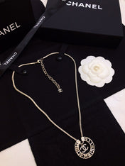 CHANEL 26S CHANEL CC LOGO MADEMOISELLE ROUND NECKLACE IN GOLD METAL 633322