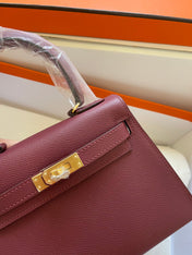 KELLY MINI 20 BAG IN GARNET RED CALFSKIN WITH GOLD HARDWARE