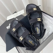 CHANEL 26S SANDALS IN BLACK FABRIC WITH PEARL-EMBELLISHED LOGO