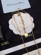 CD 26S CD LOGO CRYSTAL STATION NECKLACE IN GOLD TONE METAL WITH WHITE CRYSTAL 631006