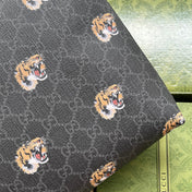 CLUTCH WITH TIGER PRINT 30 IN BLACK MONOGRAM CANVAS