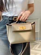 MINI 24/24 21CM IN TOGO ETOUPE EVERCOLOR CALFSKIN GOLD KELLY BUCKLE