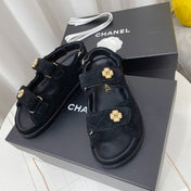 CHANEL 26S SANDALS IN BLACK SUEDE PEARL CAMELLIA EMBELLISHMENT