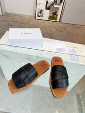 CHLOÉ WOODY MULE IN BLACK LAMBSKIN WITH EMBROIDERED LOGO