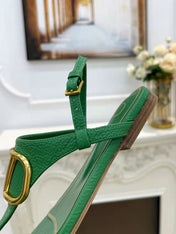 THONG SANDALS IN EMERALD GREEN CALFSKIN WITH GOLD LOGO