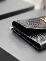 UPTOWN WALLET 21 IN BLACK CROCODILE PATTERN CALFSKIN GOLD LOGO