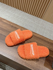 FURRY SLIDES IN ORANGE CURLY SHEARLING
