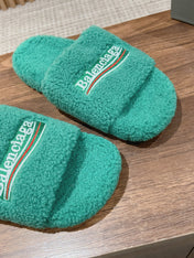 FURRY SLIDES IN TURQUOISE CURLY SHEARLING