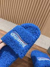 FURRY SLIDES IN COBALT BLUE CURLY SHEARLING
