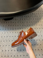 MIUMIU 26S LACE-UP BROGUE LOAFERS IN RUST ORANGE PATENT CALFSKIN