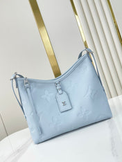 CARRYALL PM 29 IN BEAU BLUE MONOGRAM EMPREINTE LEATHER