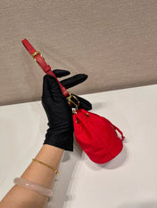 MINI BUCKET BAG 10 IN RED RE-NYLON AND SAFFIANO LEATHER STRAP