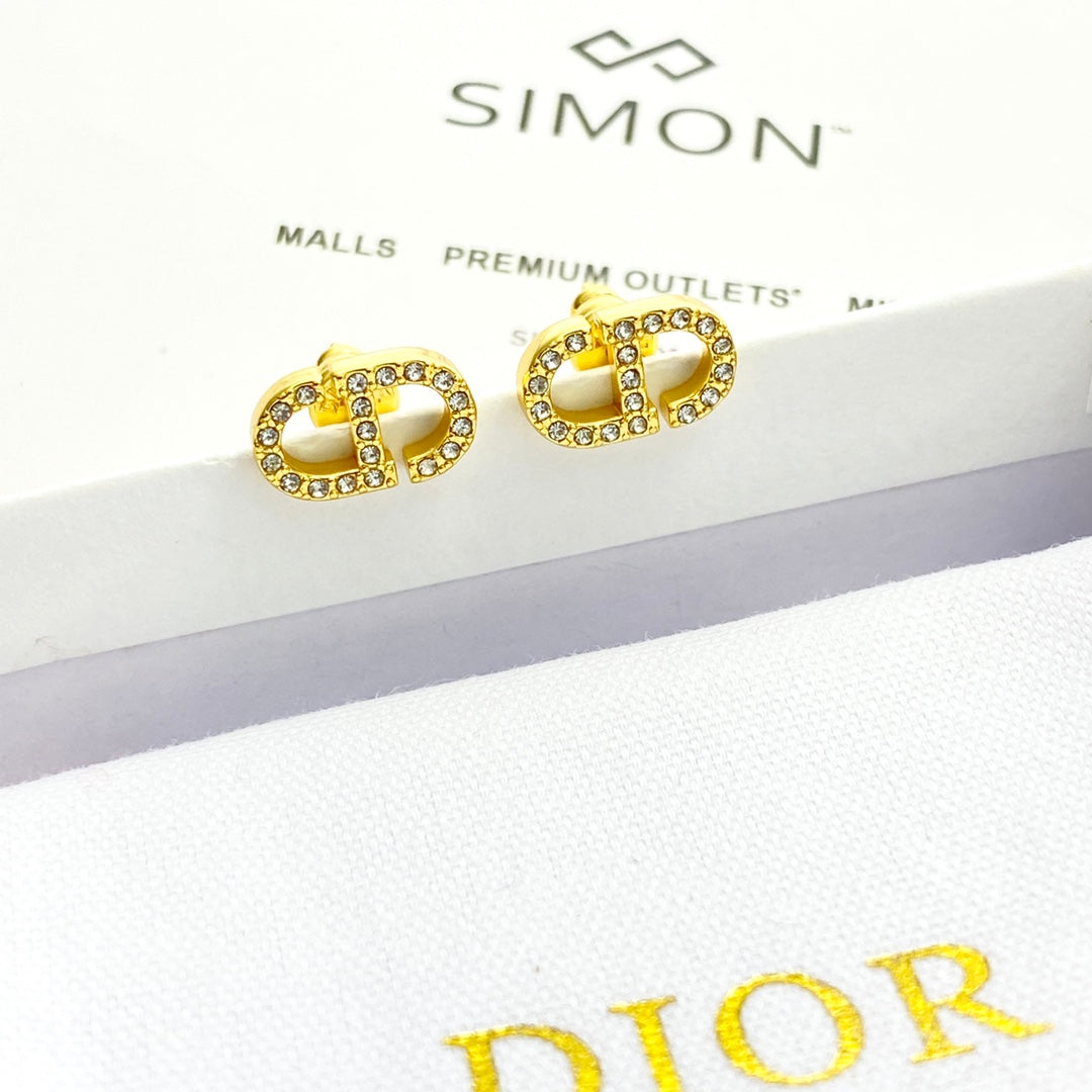 CD 26S CRYSTAL LOGO STUD EARRINGS IN GOLD METAL 633106
