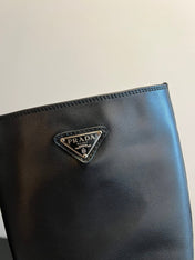 PRADA 25S HIGH-CUT PLATFORM BOOTS IN BLACK CALFSKIN WITH SILVER HARDWARE