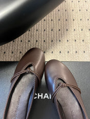 BOTTEGA VENETA 26S FLAT MULES IN DARK BROWN LAMBSKIN
