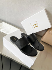 THE ROW 26S FLAT THONG SANDALS IN BLACK CALFSKIN
