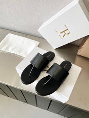 THE ROW 26S FLAT THONG SANDALS IN BLACK CALFSKIN