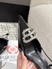 POINTED HIGH SLINGBACK IN BLACK PATENT CALFSKIN WITH CRYSTAL BUCKLE