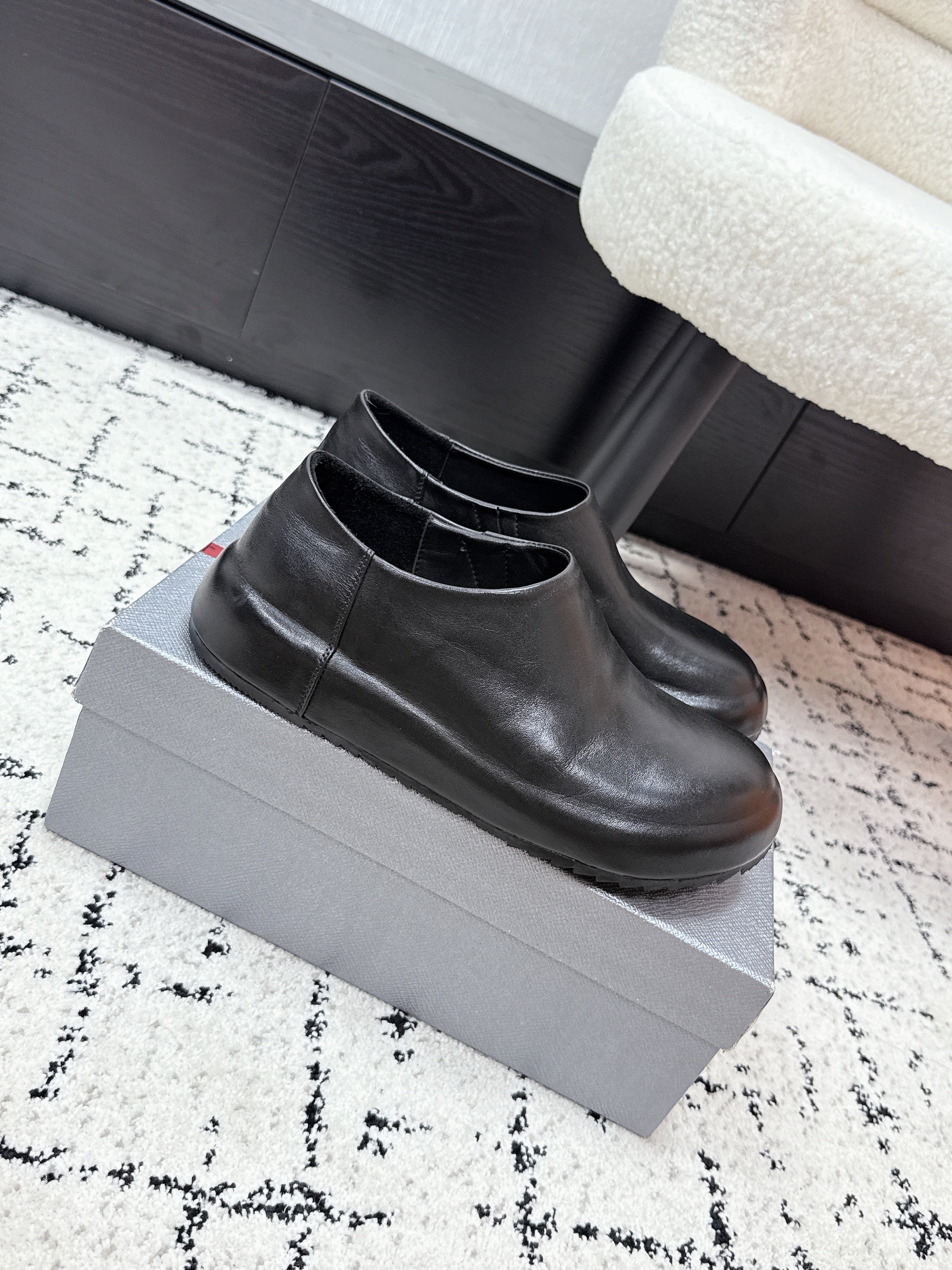 PRADA 26S SLIP ON SHOES IN BLACK SMOOTH CALFSKIN
