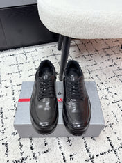 PRADA 26S SNEAKERS IN BLACK SHINY CALFSKIN