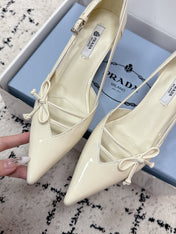 PRADA 26S POINTED-TOE HIGH HEELS 55MM IN IVORY WHITE CALFSKIN WITH BOW