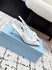 PRADA 26S SLINGBACK PUMPS 60MM IN WHITE PATENT CALFSKIN