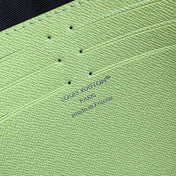 POCHETTE VOYAGE 26 IN LEMON YELLOW MONOGRAM ECLIPSE CALFSKIN