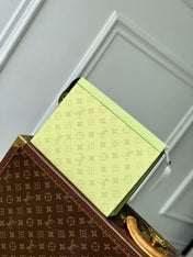 POCHETTE VOYAGE 26 IN LEMON YELLOW MONOGRAM ECLIPSE CALFSKIN