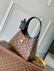 THE DROP PM 28 IN BROWN MONOGRAM COATED CANVAS AND CALFSKIN