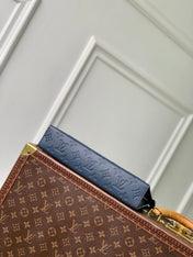 POCHETTE VOYAGE 27 IN DARK BLUE MONOGRAM ECLIPSE CALFSKIN EMBOSSED LOGO
