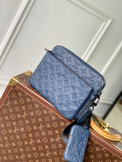 TRIO MESSENGER 25 IN BLUE MONOGRAM SHADOW CALFSKIN