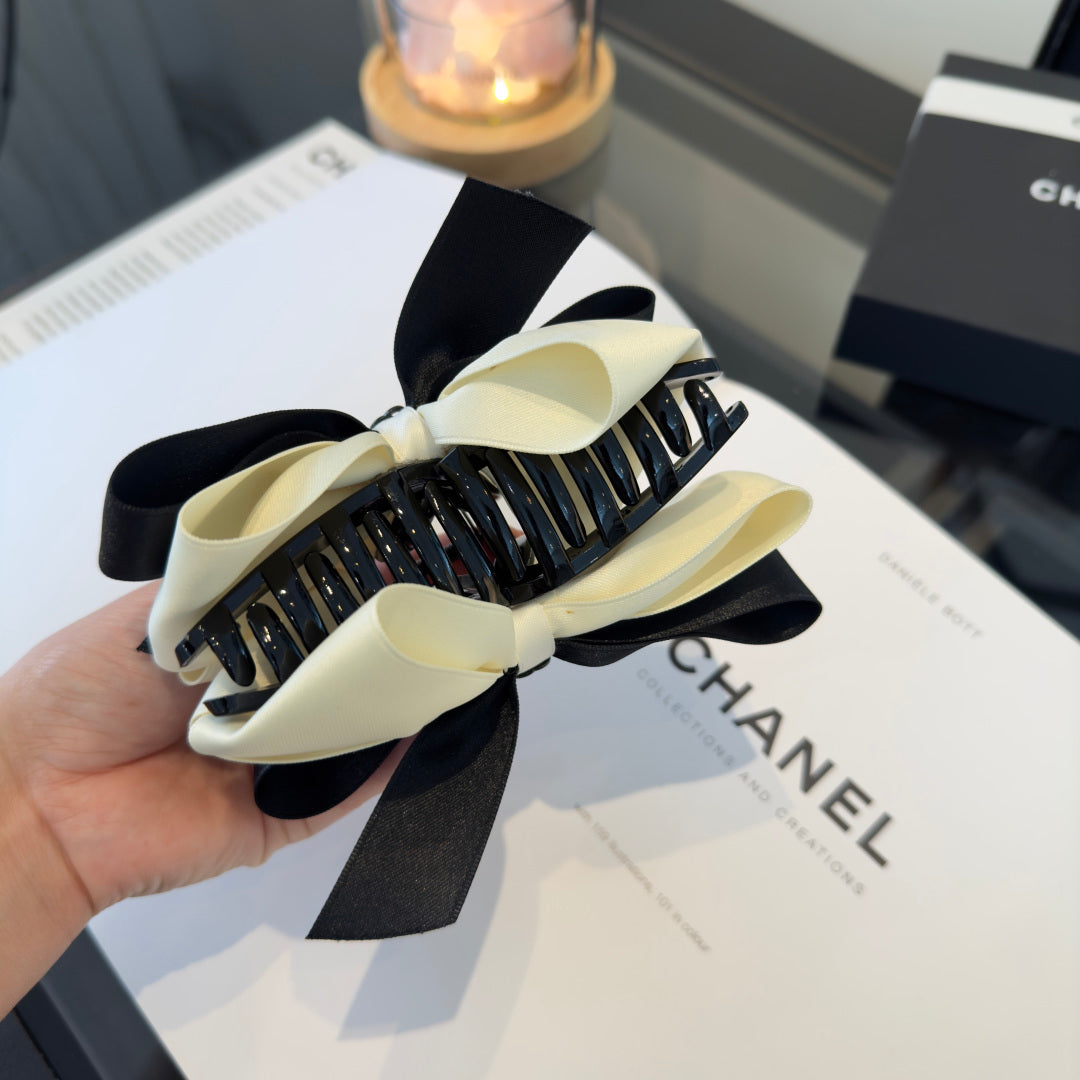 CHANEL 26S BOW HAIR CLIP IN BLACK AND WHITE SATIN 503131