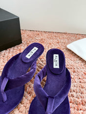 ALAIA 26S HEELED THONG SANDALS IN DARK PURPLE VELVET