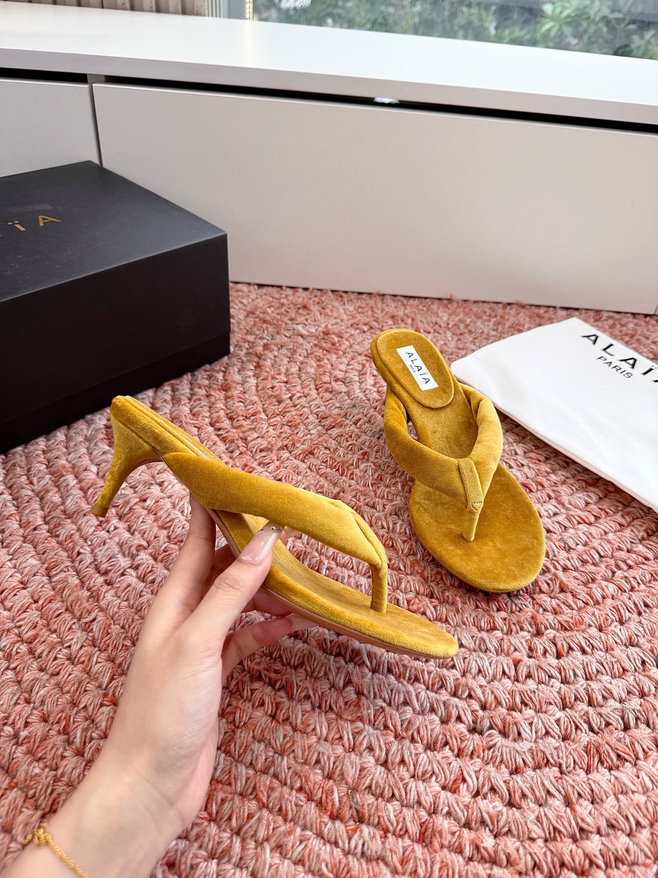 ALAIA 26S HEELED THONG SANDALS IN MUSTARD YELLOW VELVET