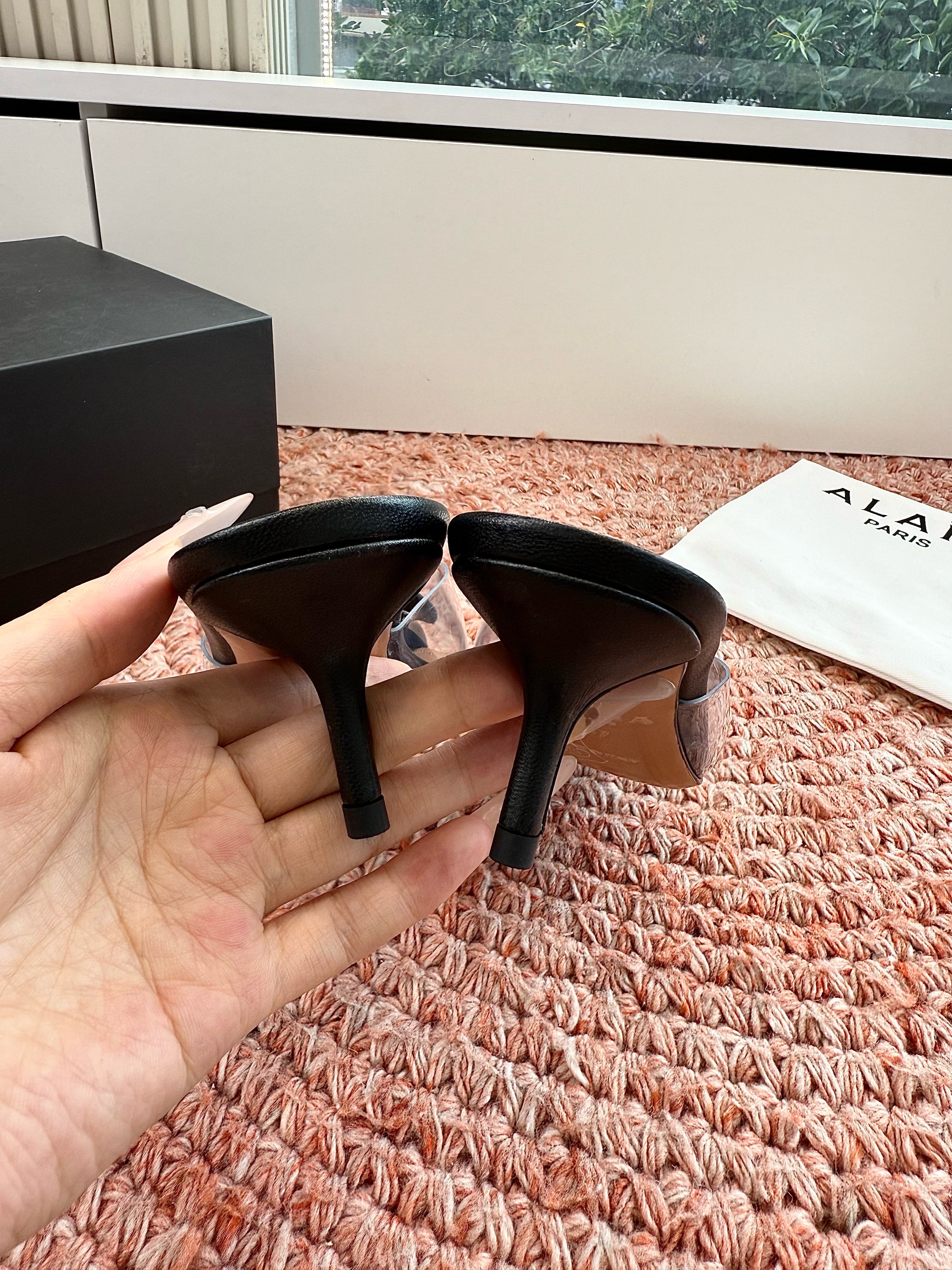 ALAIA 26S MULE HEELS IN BLACK LAMBSKIN AND TRANSPARENT PVC