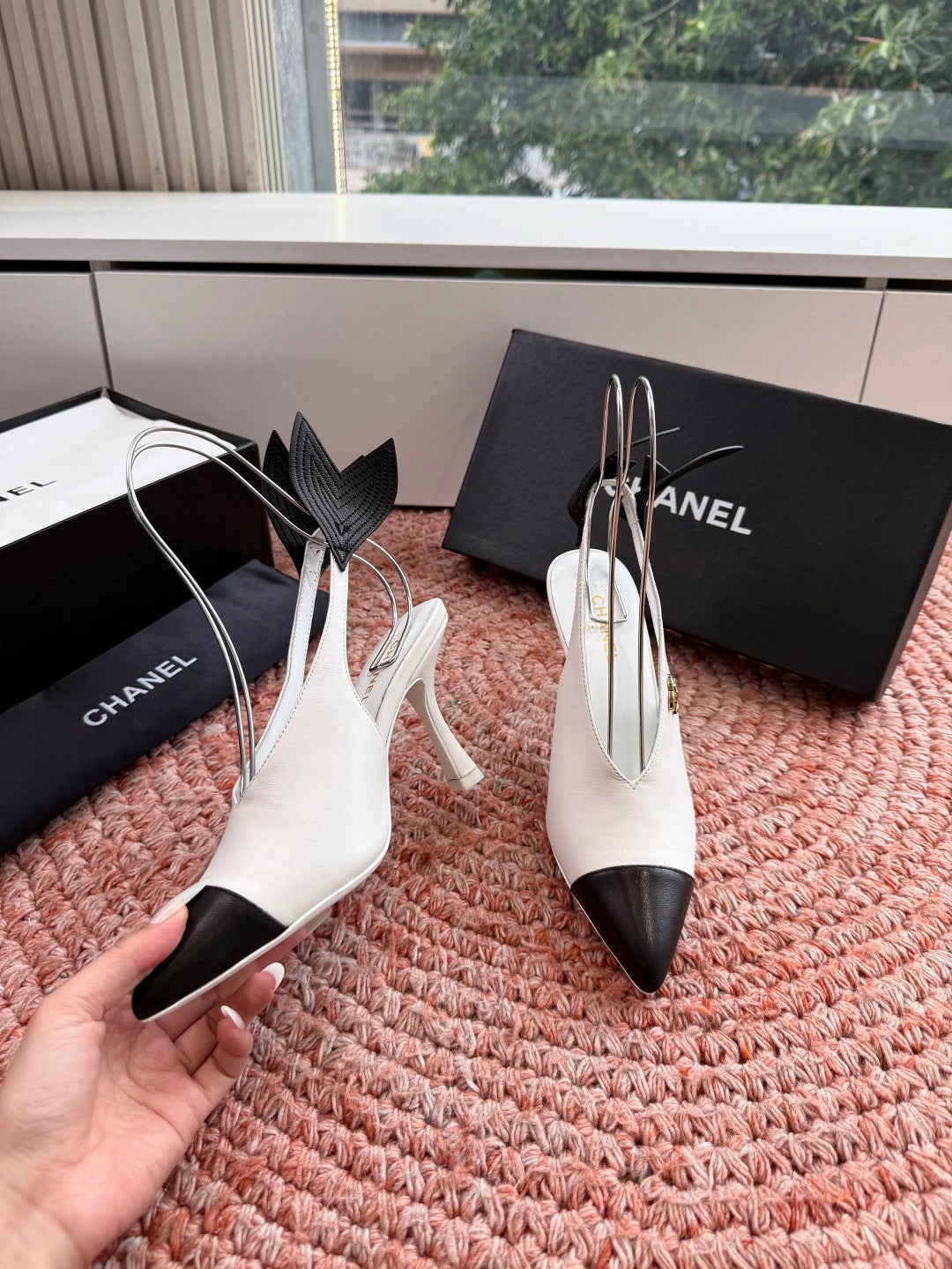 CHANEL 26S POINTED TOE HIGH HEEL SLINGBACKS IN WHITE LAMBSKIN WITH BLACK FLORAL APPLIQUE