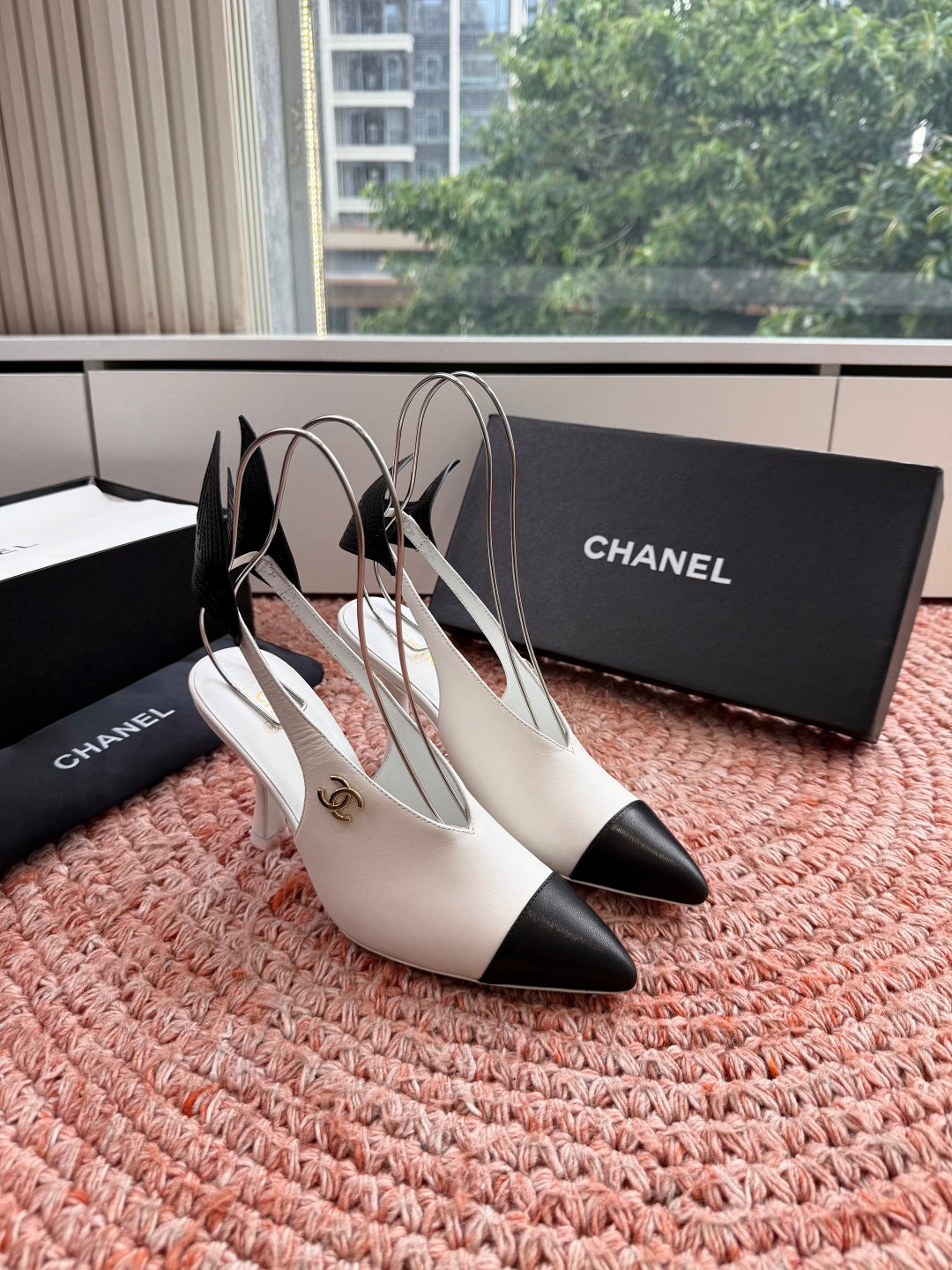 CHANEL 26S POINTED TOE HIGH HEEL SLINGBACKS IN WHITE LAMBSKIN WITH BLACK FLORAL APPLIQUE