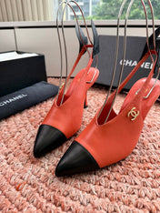 CHANEL 26S POINTED TOE HIGH HEEL SLINGBACKS IN ORANGE LAMBSKIN WITH BLACK FLORAL APPLIQUE