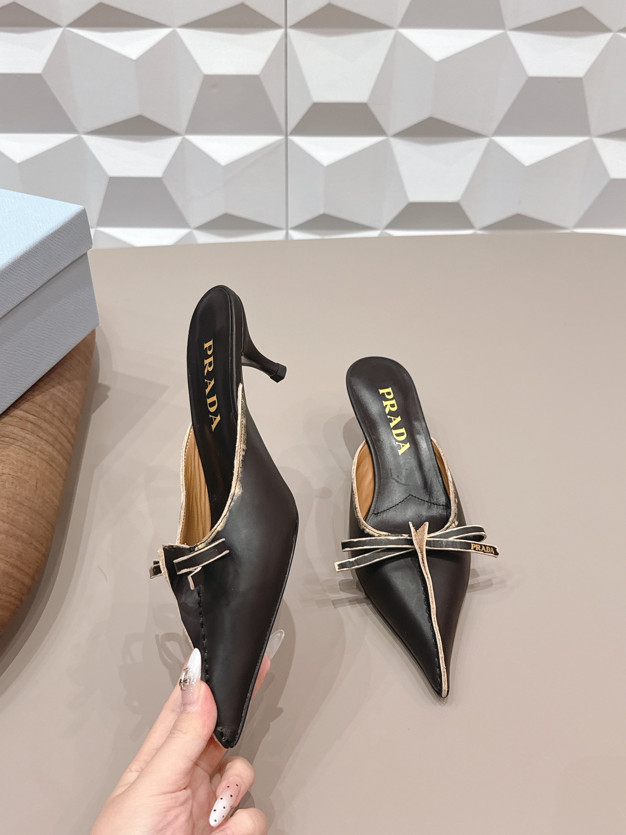 PRADA 26S POINTED TOE LACE TRIM MULES 55MM IN BLACK CALFSKIN WITH BOW
