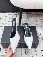 ALAIA 26S HEELED MULES 65 MM IN WHITE GLOSSY CALFSKIN