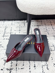 ALAIA 26S HEELED MULES 65 MM IN DARK RED GLOSSY CALFSKIN