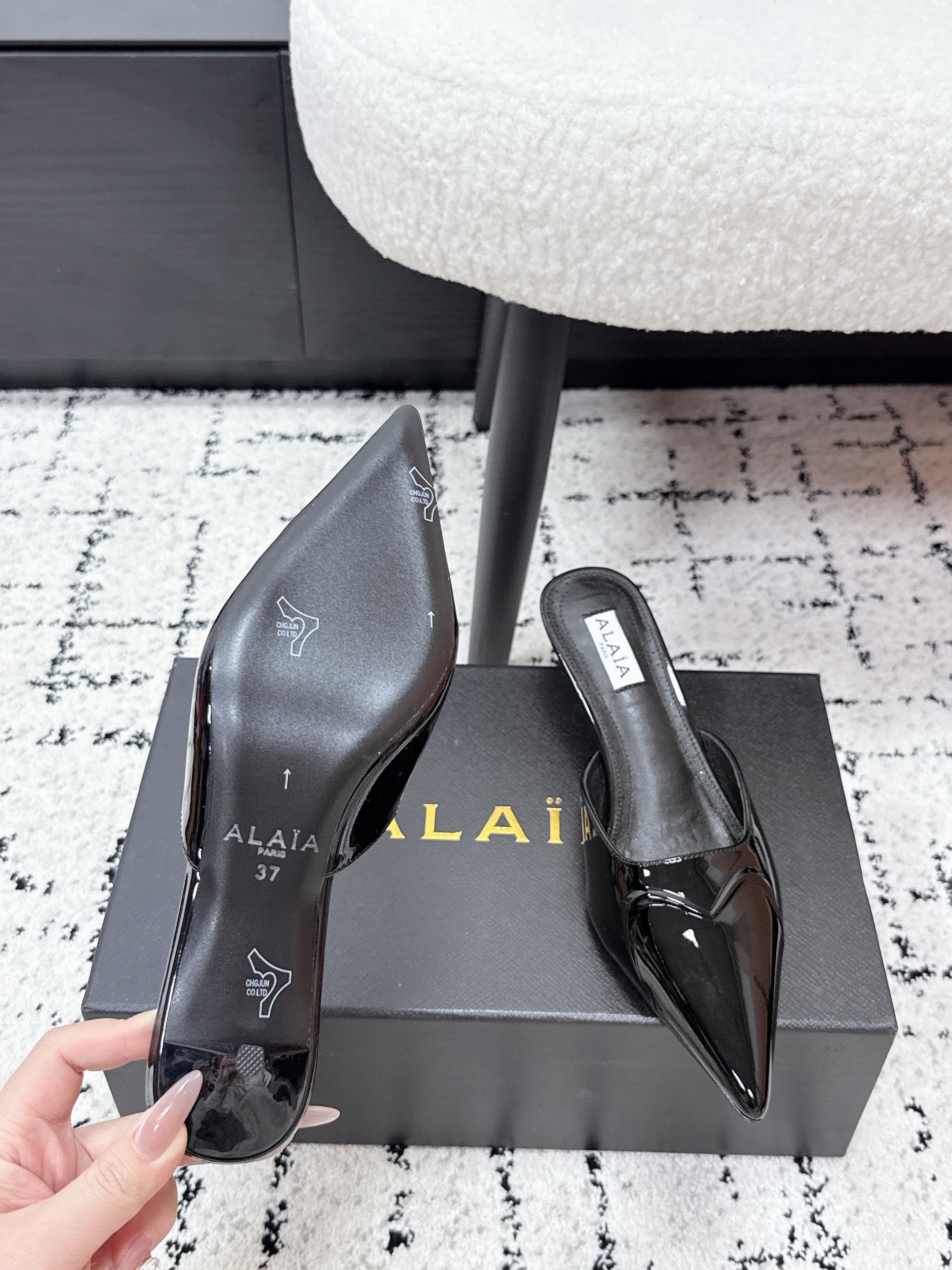 ALAIA 26S HEELED MULES 65 MM IN BLACK GLOSSY CALFSKIN