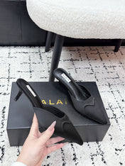 ALAIA 26S HEELED MULES 65 MM IN BLACK SATIN